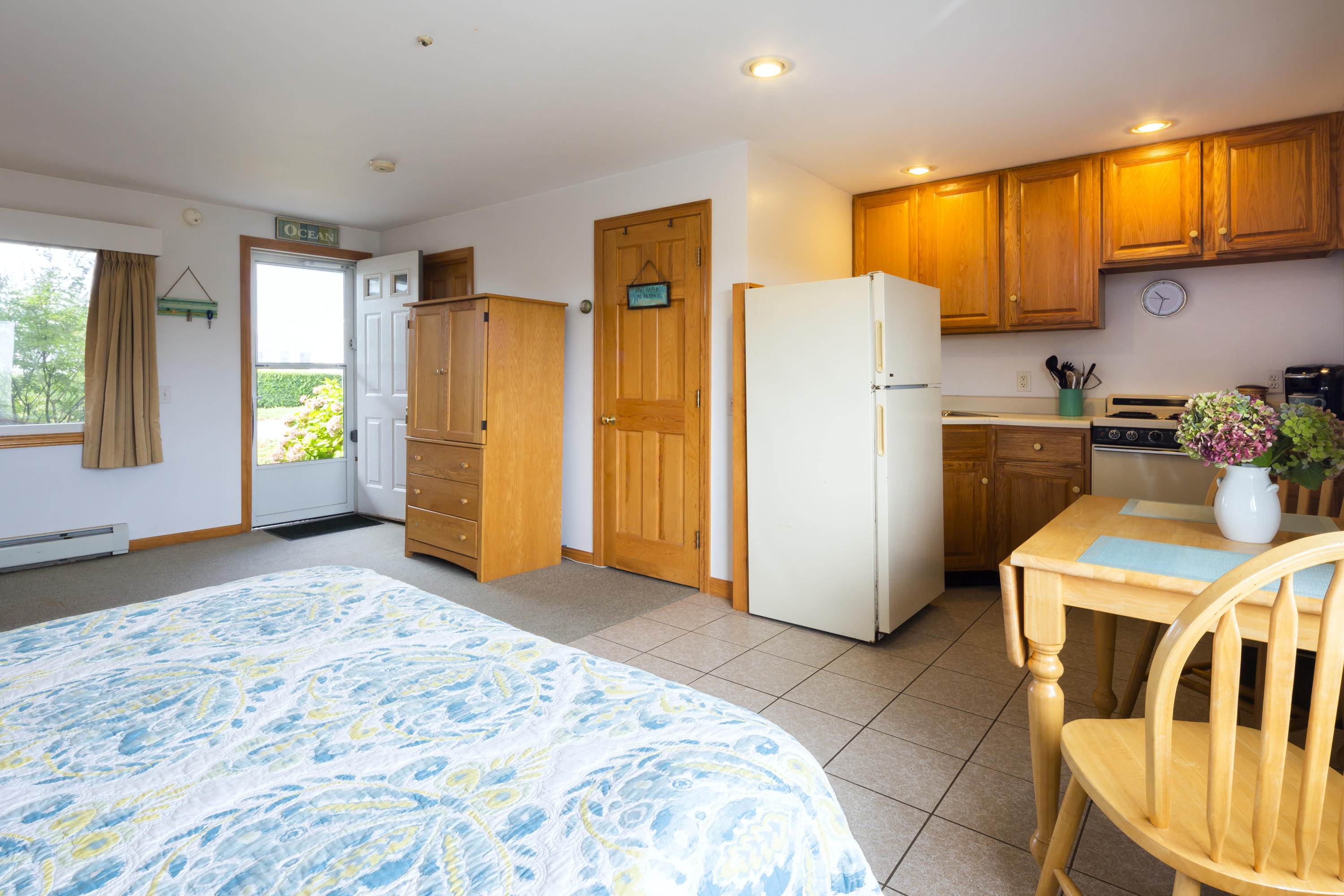 307 Shore Road, Unit 9 & SB2 Truro, MA 02666 - Photo 4 of 13 a bedroom with a bed and a refrigerator
