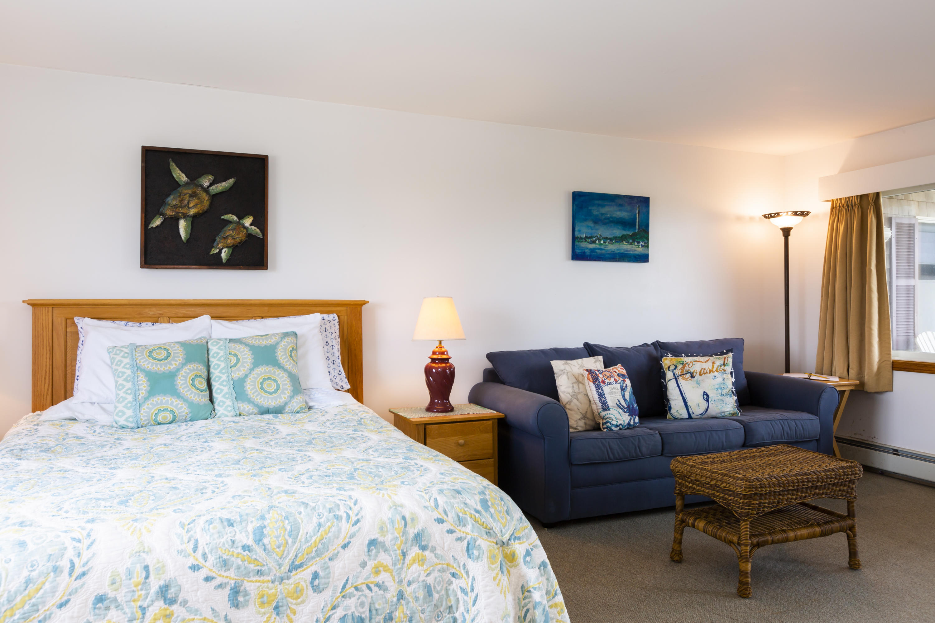 307 Shore Road, Unit 9 & SB2 Truro, MA 02666 - Photo 5 of 13 a bedroom with a bed and couch