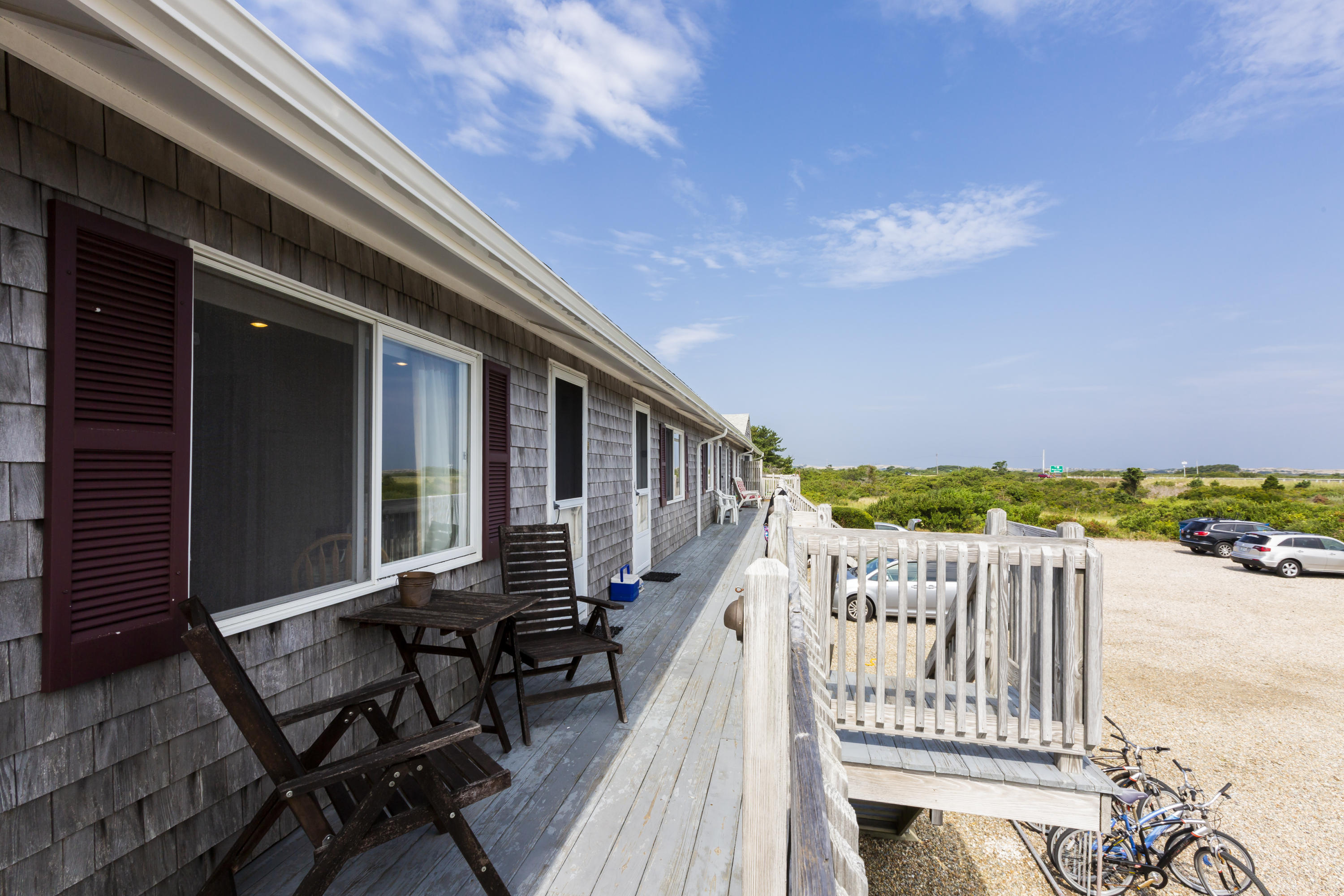 307 Shore Road, Unit 9 & SB2 Truro, MA 02666 - Photo 7 of 13 a view of a chairs on the roof deck