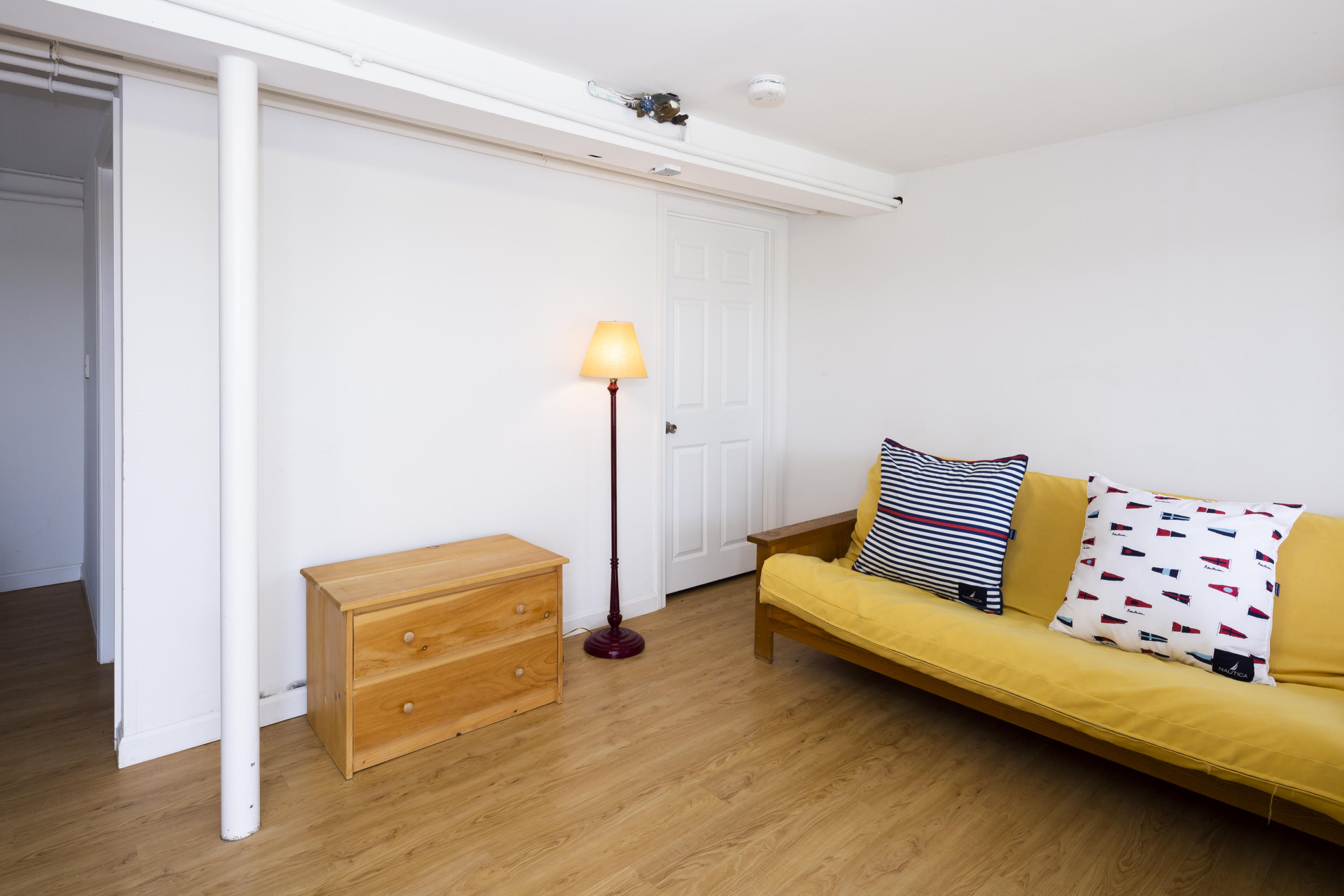 307 Shore Road, Unit 9 & SB2 Truro, MA 02666 - Photo 8 of 13 a bedroom with a bed and a dresser