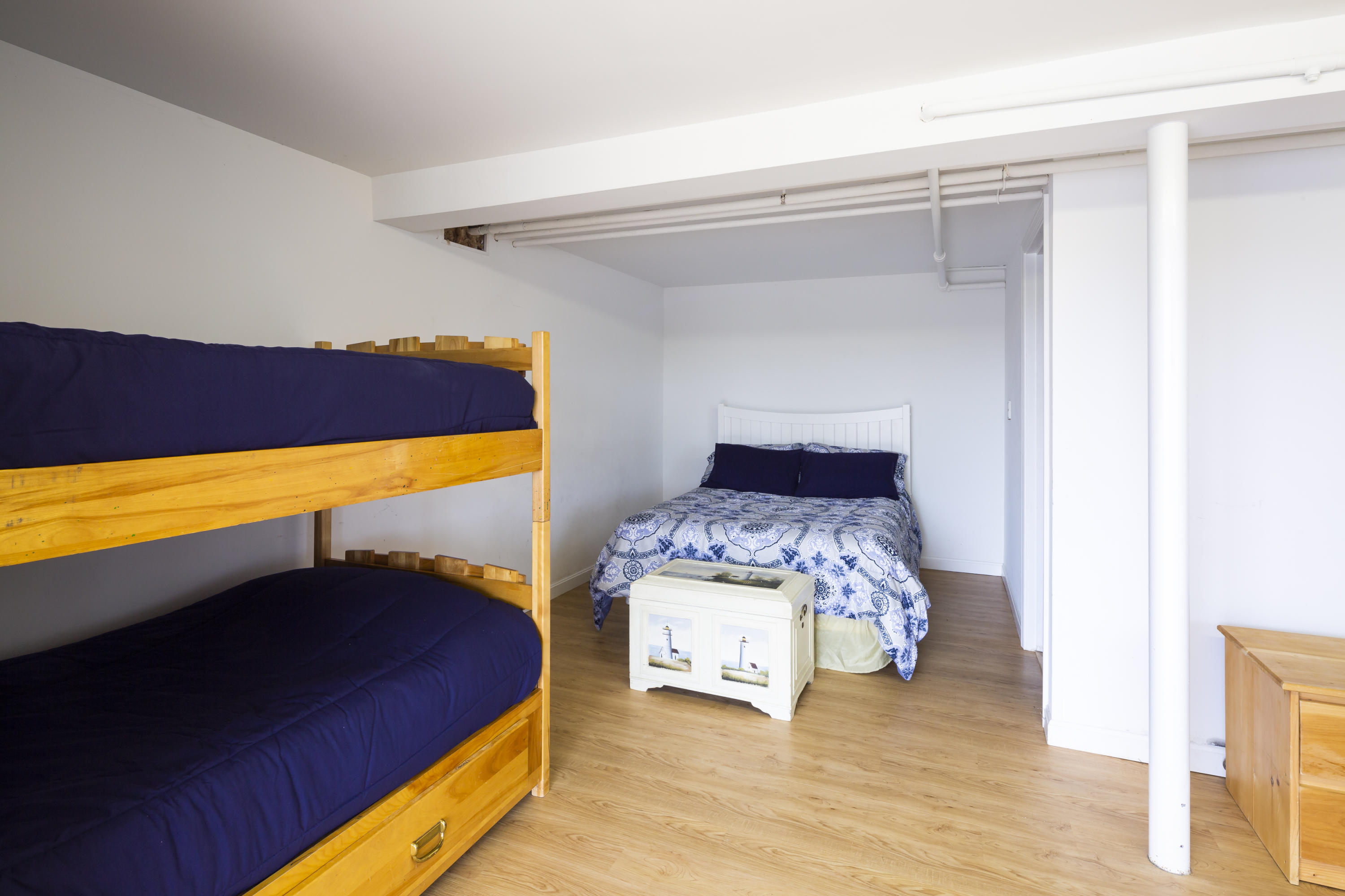 307 Shore Road, Unit 9 & SB2 Truro, MA 02666 - Photo 10 of 13 a bedroom with a bed and a view of walk in closet