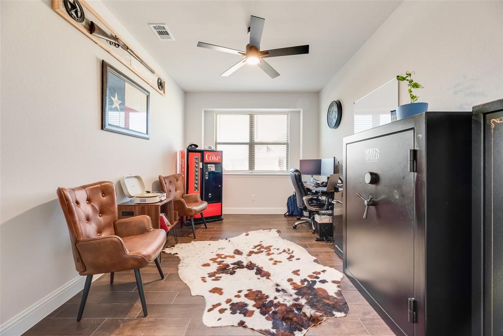 561 Randys Way Pilot Point, TX 76258 - Photo 11 of 34 a living room with furniture and a chandelier