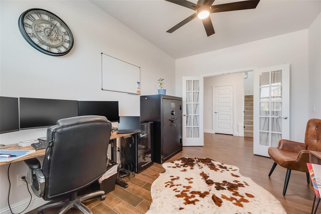 561 Randys Way Pilot Point, TX 76258 - Photo 12 of 34 a workspace with a desk chair and painted walls