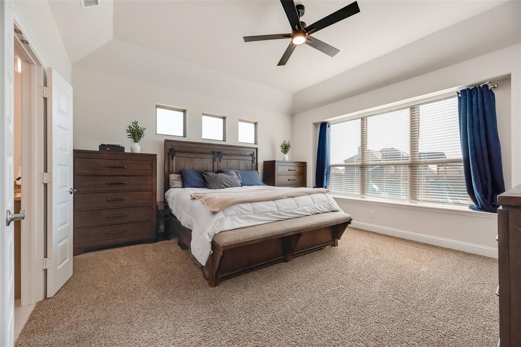 561 Randys Way Pilot Point, TX 76258 - Photo 14 of 34 a bed room with a bed and a large window