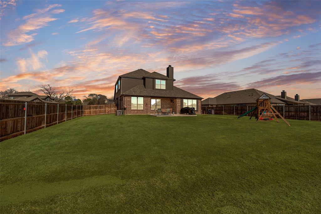 561 Randys Way Pilot Point, TX 76258 - Photo 31 of 34 a front view of a house with garden