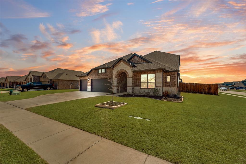 561 Randys Way Pilot Point, TX 76258 - Photo 32 of 34 a front view of a house with a garden