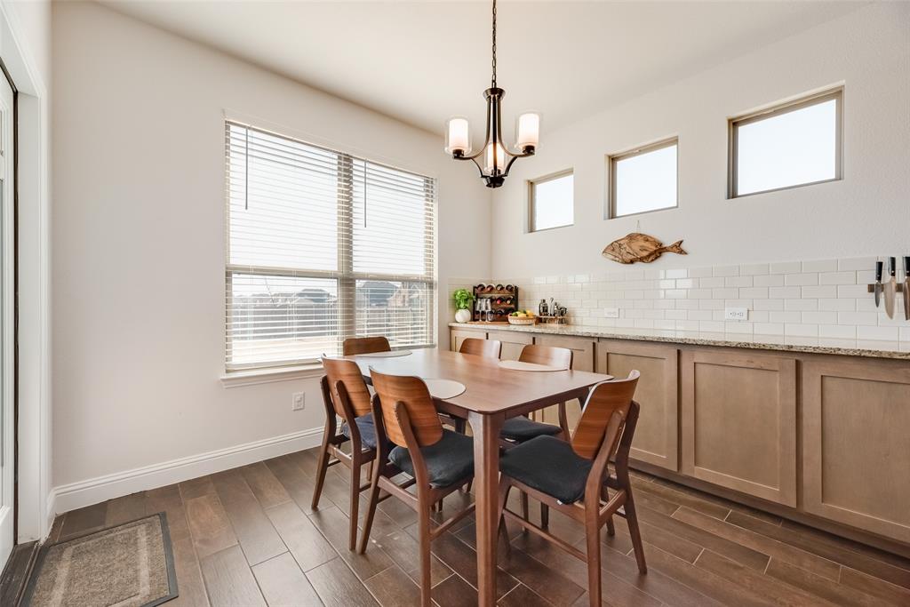561 Randys Way Pilot Point, TX 76258 - Photo 4 of 34 a view of a dining room with furniture window and wooden floor