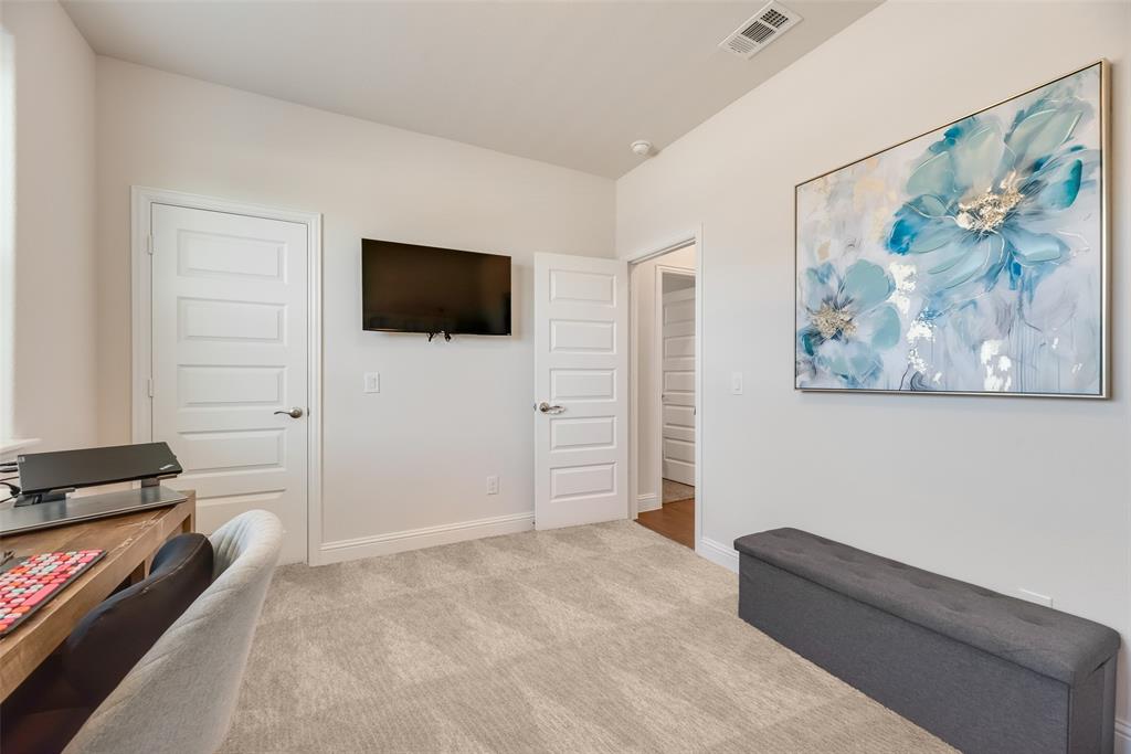 561 Randys Way Pilot Point, TX 76258 - Photo 10 of 34 a living room with furniture and a flat screen tv