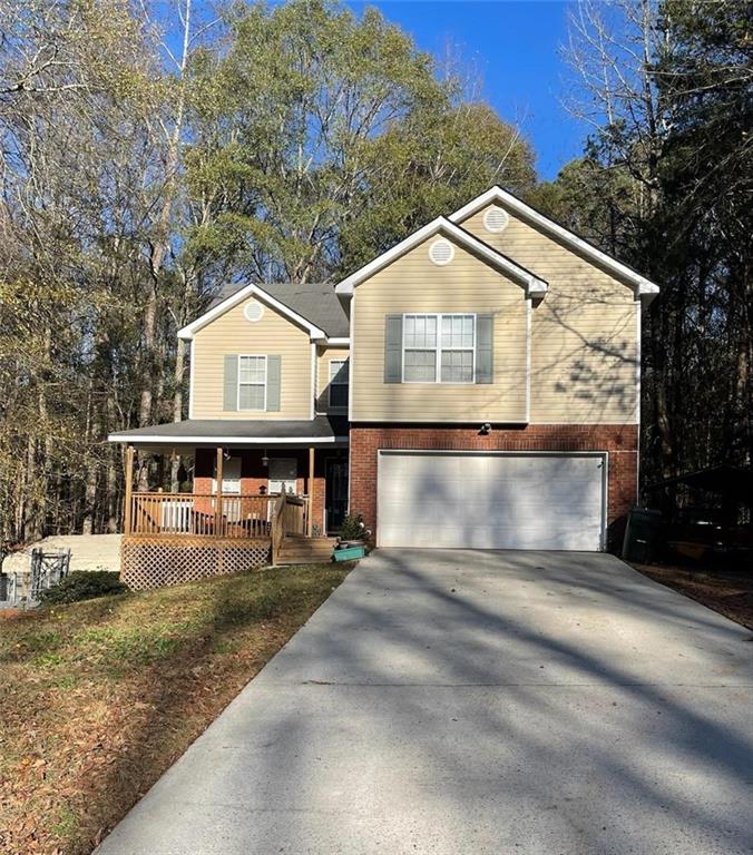 4035 Jewel Ridge Monroe, GA 30655 - Photo 1 of 1 View of front of home featuring a garage and a porch