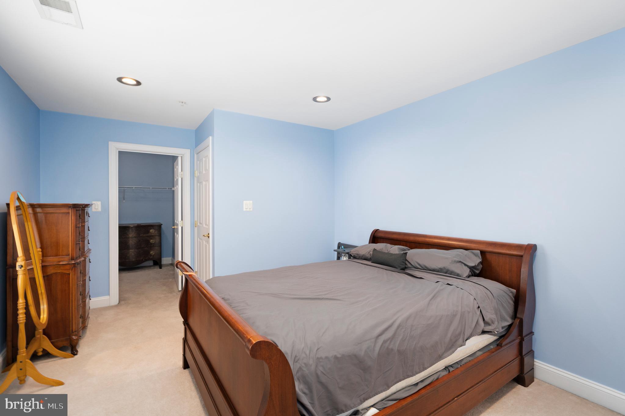 818 Hidden Bluff Circle Catonsville, MD 21228 - Photo 19 of 36 a bedroom with a bed and a refrigerator