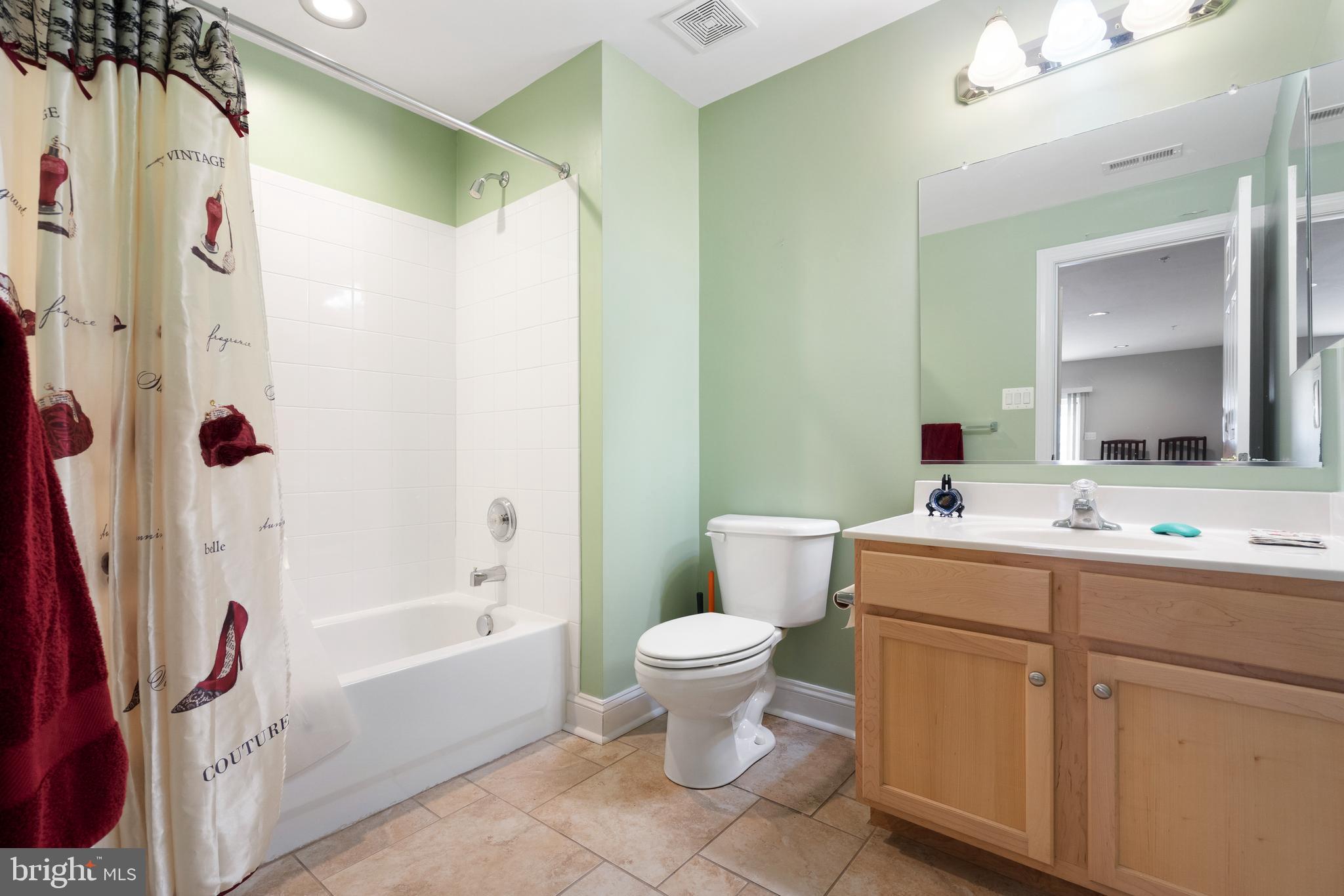 818 Hidden Bluff Circle Catonsville, MD 21228 - Photo 28 of 36 a bathroom with a sink a toilet and a mirror