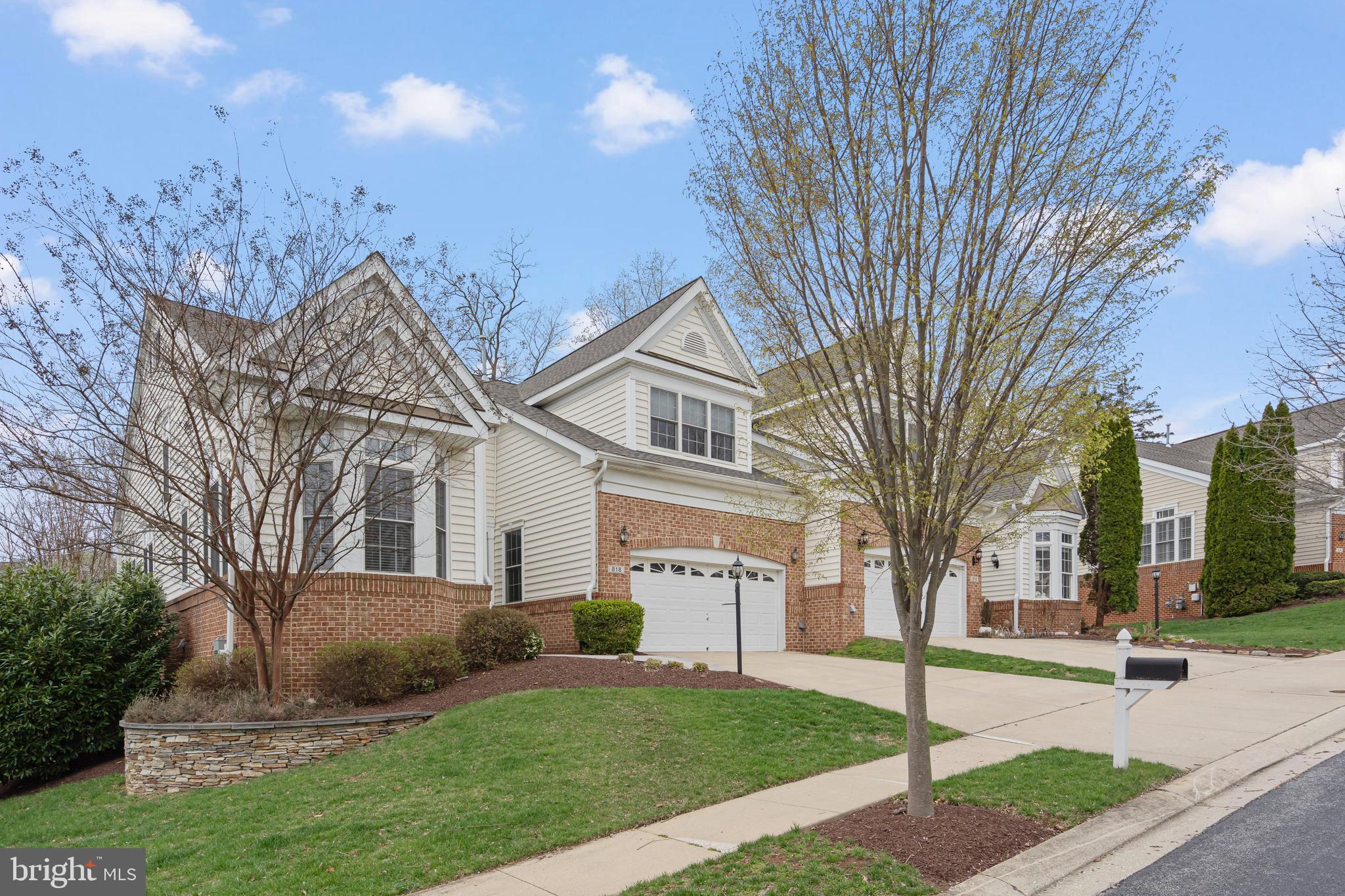 818 Hidden Bluff Circle Catonsville, MD 21228 - Photo 36 of 36 a view of a white house next to a yard with large trees