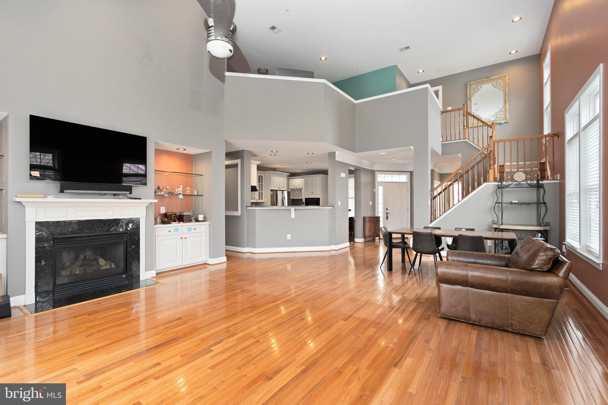 818 Hidden Bluff Circle Catonsville, MD 21228 - Photo 5 of 36 a living room with furniture a flat screen tv and a fireplace