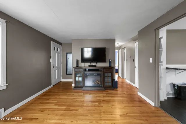 a view of living room with furniture and flat screen tv