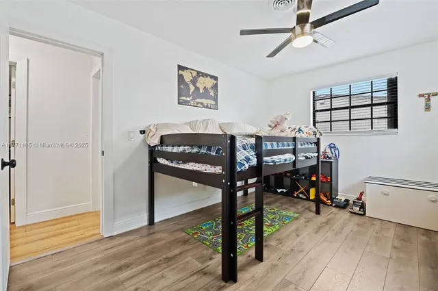 a view of a livingroom with furniture and hardwood floor