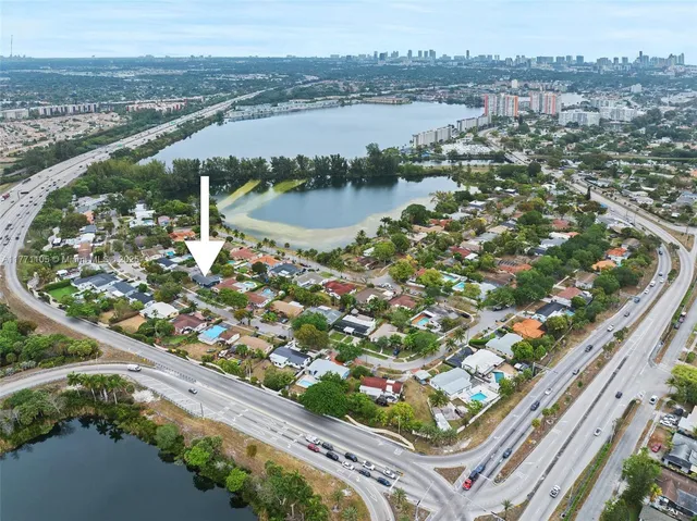 an aerial view of a house with a swimming pool