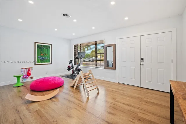 a room with furniture and wooden floor