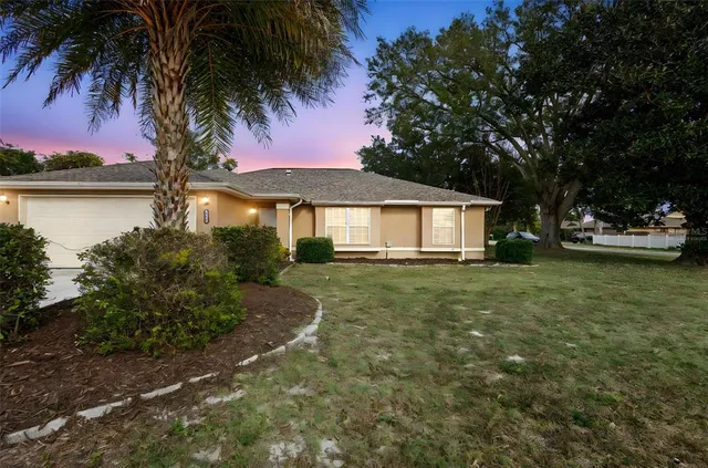 a house with swimming pool in front of it