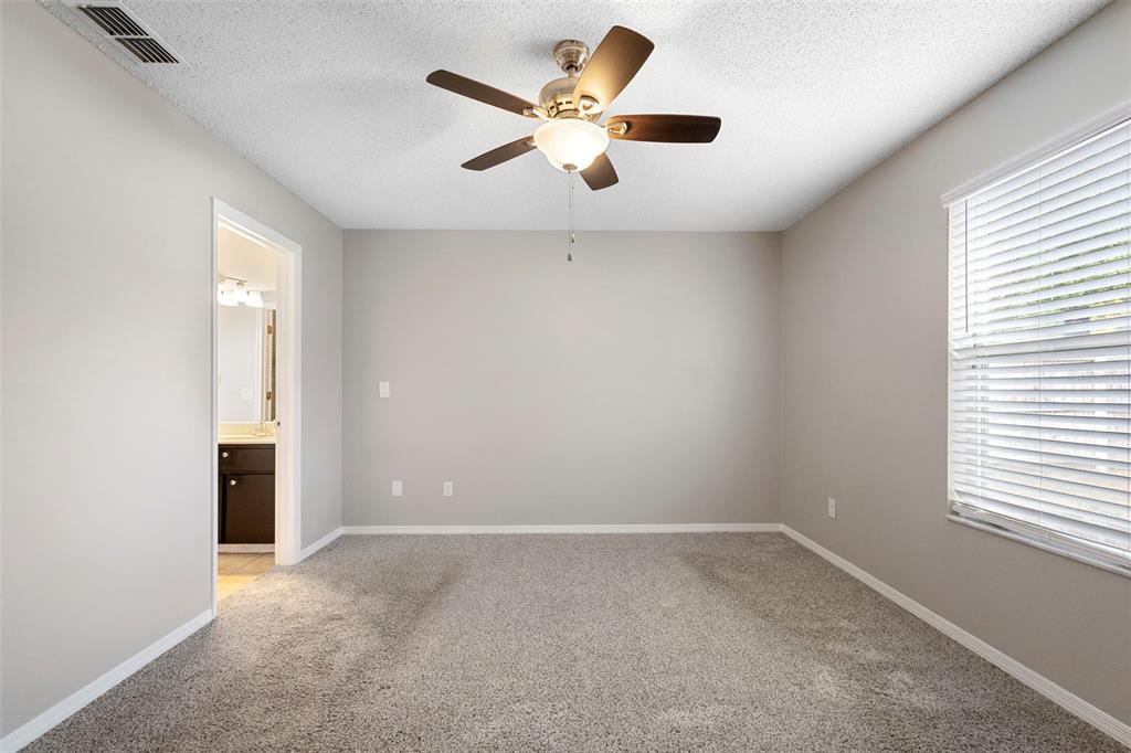 1031 Abeline Drive Deltona, FL 32725 - Photo 26 of 37 a view of an empty room with a window