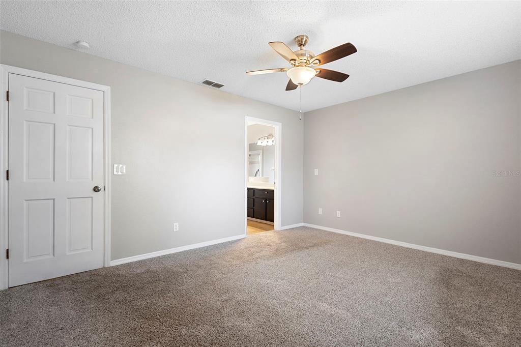 1031 Abeline Drive Deltona, FL 32725 - Photo 27 of 37 a view of an empty room with chandelier fan and window