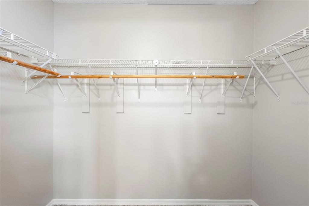 1031 Abeline Drive Deltona, FL 32725 - Photo 29 of 37 a view of walk in closet with clothes