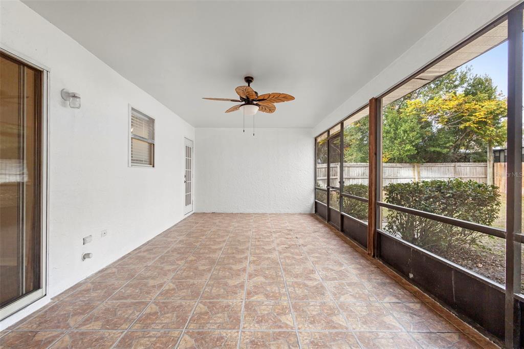 1031 Abeline Drive Deltona, FL 32725 - Photo 35 of 37 wooden floor in an empty room with a large window