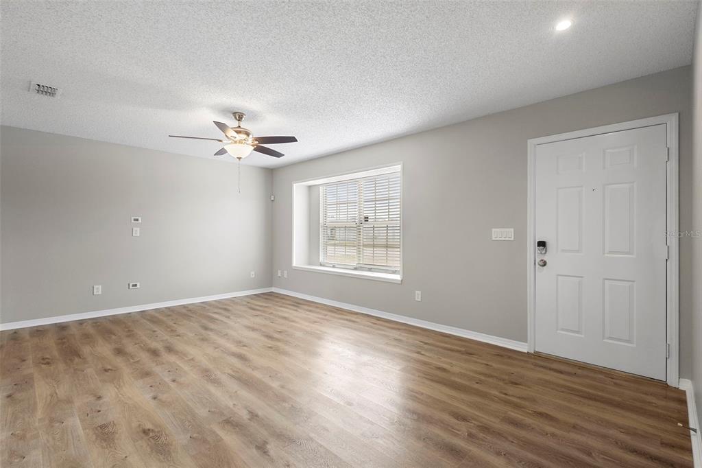1031 Abeline Drive Deltona, FL 32725 - Photo 6 of 37 a view of an empty room with a window