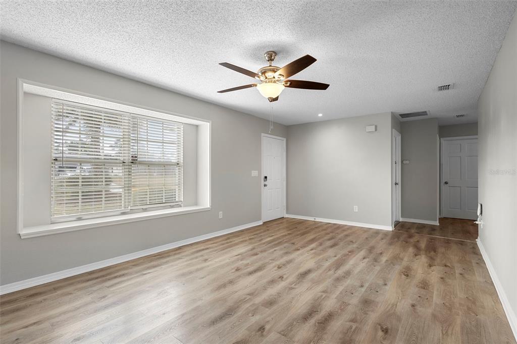 1031 Abeline Drive Deltona, FL 32725 - Photo 7 of 37 a view of an empty room with a window