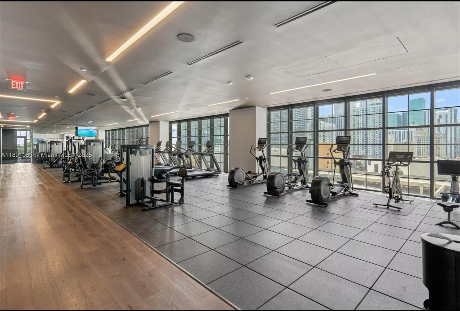601 Northeast 1st Avenue, Unit 1619 Miami, FL 33132 - Photo 16 of 17 a view of a room with gym equipment and a large window