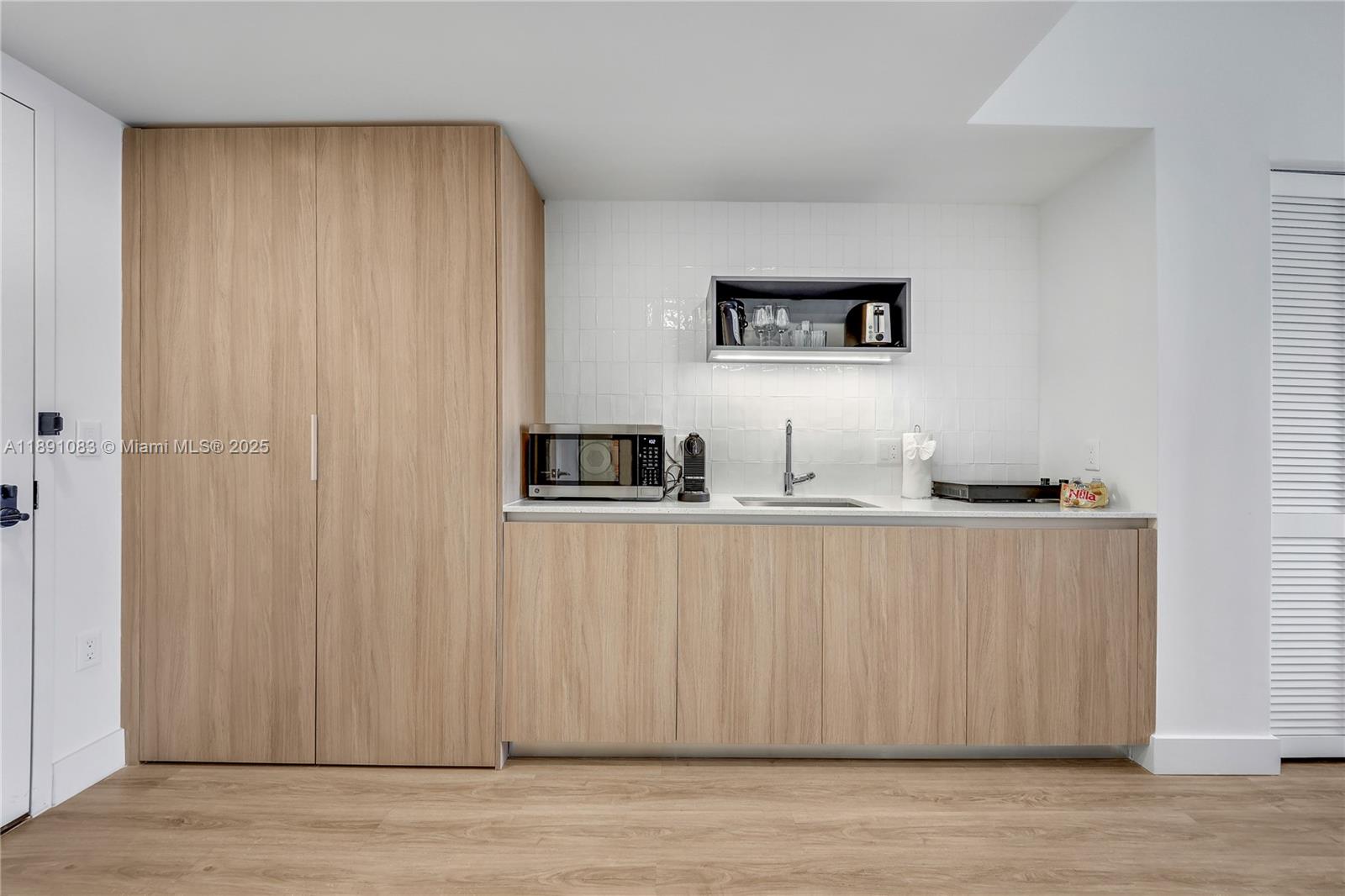 601 Northeast 1st Avenue, Unit 1619 Miami, FL 33132 - Photo 2 of 17 a view of a livingroom with furniture and wooden floor
