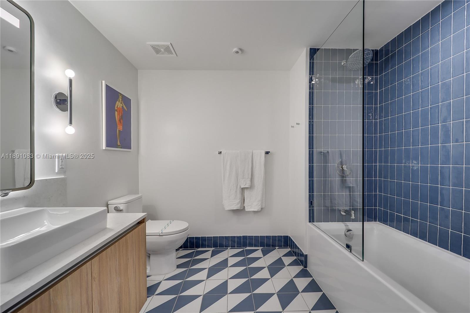 601 Northeast 1st Avenue, Unit 1619 Miami, FL 33132 - Photo 3 of 17 a bathroom with a bathtub sink and toilet