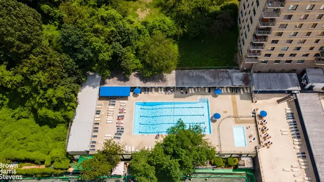 an aerial view of residential houses with outdoor space and street view