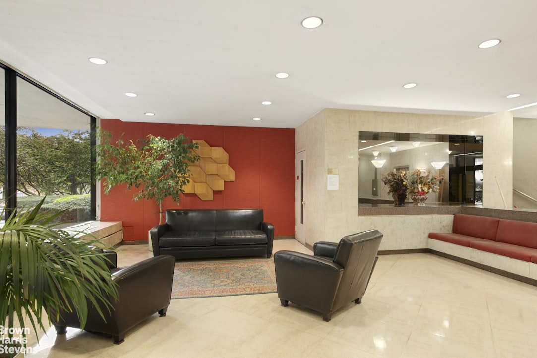3671 Hudson Manor Terrace, Unit 4F Bronx, NY 10463 - Photo 14 of 14 a living room with furniture and a large window
