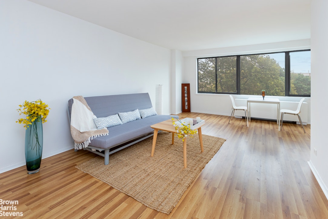 3671 Hudson Manor Terrace, Unit 4F Bronx, NY 10463 - Photo 2 of 14 a living room with furniture and wooden floor
