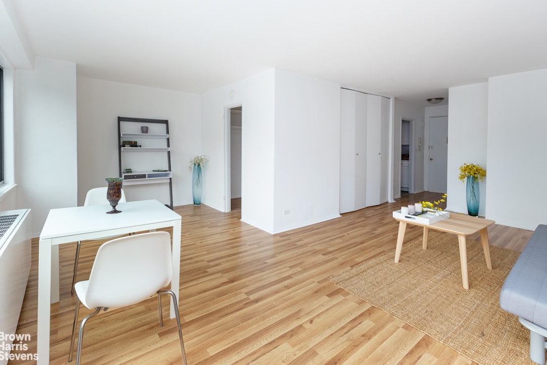 3671 Hudson Manor Terrace, Unit 4F Bronx, NY 10463 - Photo 3 of 14 a view of a dining room with furniture and wooden floor