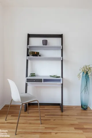 a view of table and chair in wooden floor