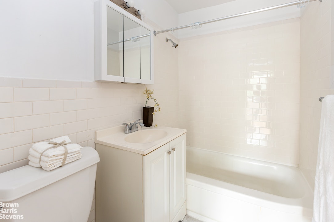 3671 Hudson Manor Terrace, Unit 4F Bronx, NY 10463 - Photo 8 of 14 a utility room with dryer and washer