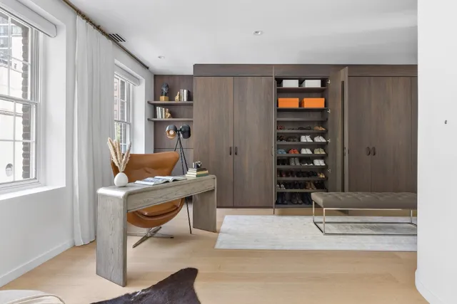 a workspace with furniture and window