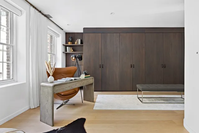 a workspace with furniture and window