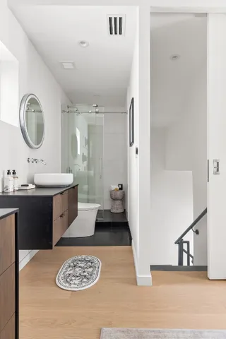 a bathroom with a sink double vanity and a mirror