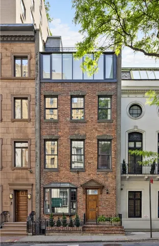 a front view of a building with garden