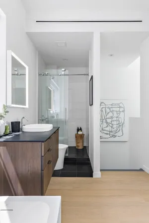 a bathroom with a sink a mirror and a bathtub