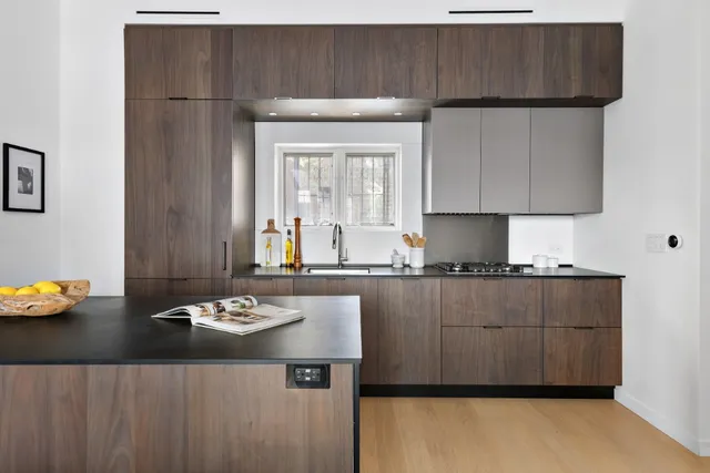 a kitchen with a cabinets and wooden floor