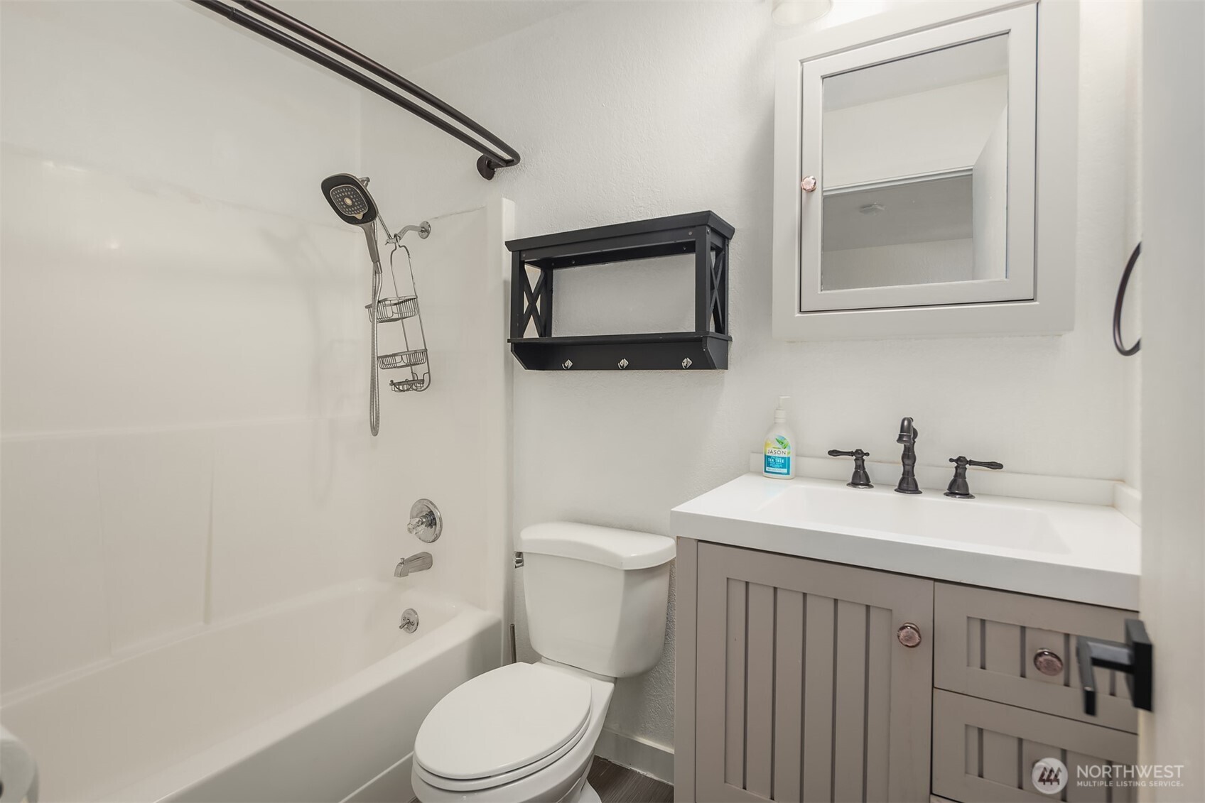 8603 244th Street Southwest, Unit 2D Edmonds, WA 98026 - Photo 17 of 21 a bathroom with a sink a toilet and shower