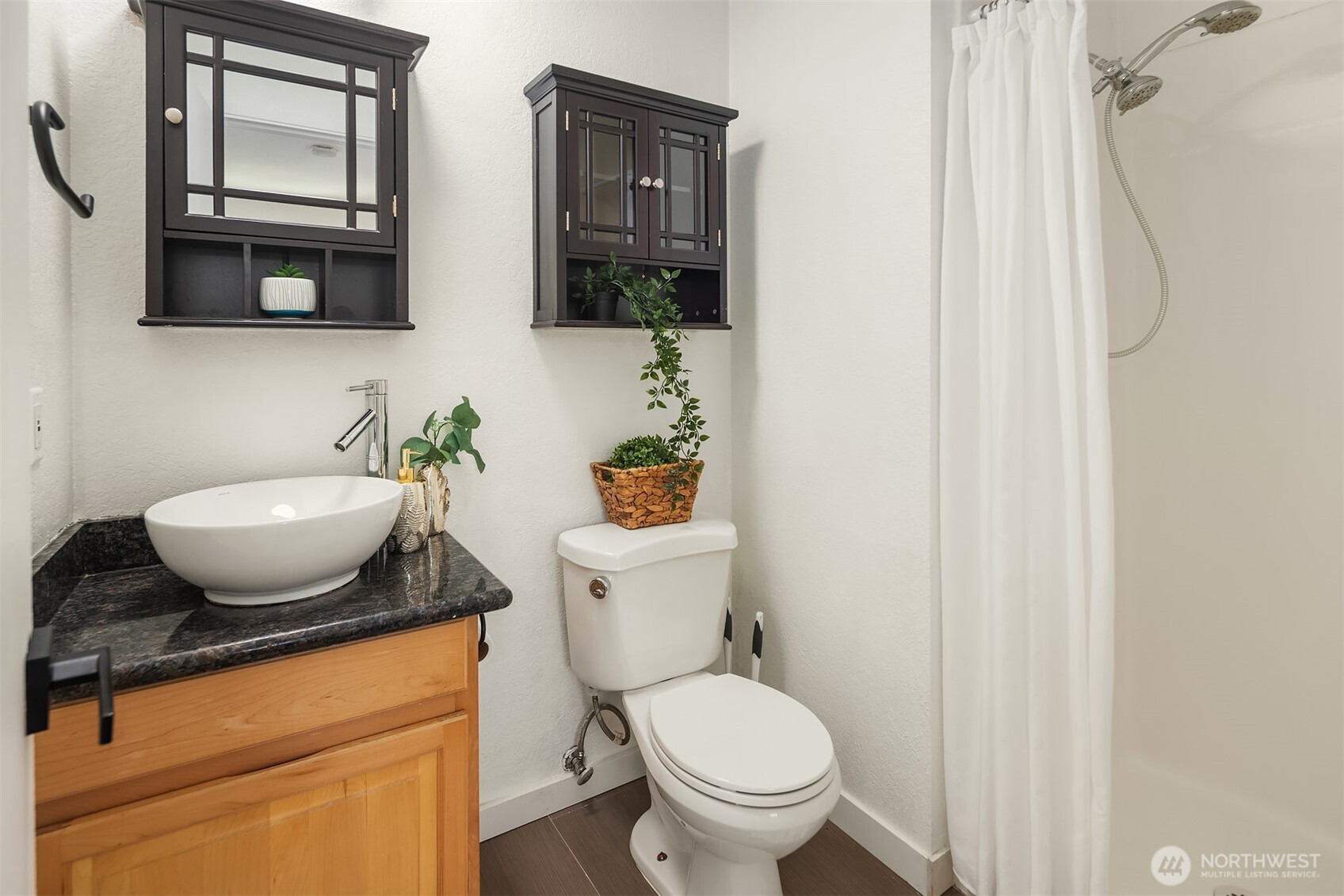 8603 244th Street Southwest, Unit 2D Edmonds, WA 98026 - Photo 20 of 21 a bathroom with a granite countertop toilet sink and mirror