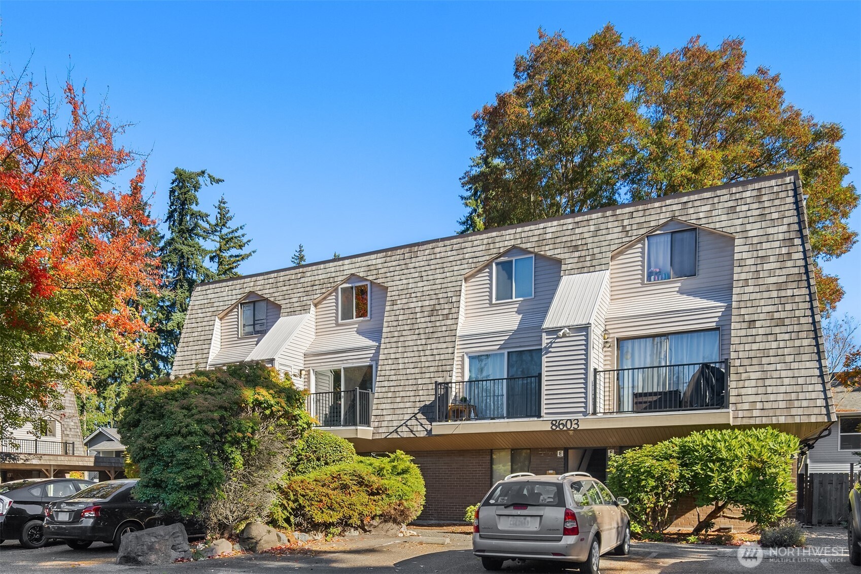 8603 244th Street Southwest, Unit 2D Edmonds, WA 98026 - Photo 3 of 21 a front view of a house with a yard