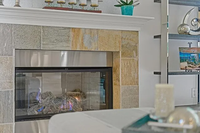 a kitchen with stainless steel appliances granite countertop a stove a sink a refrigerator and a refrigerator