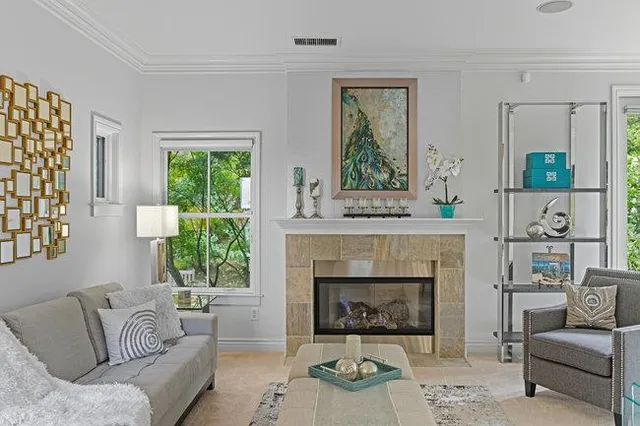 a living room with furniture and a fireplace