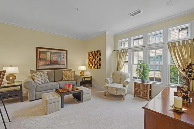 a bedroom with a bed and a large mirror