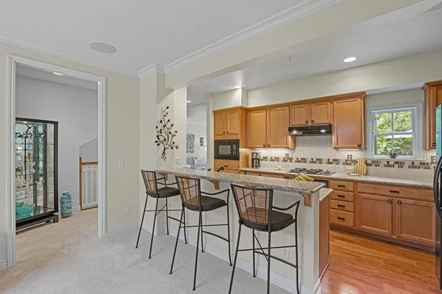 a white toilet sitting next to a bathroom sink